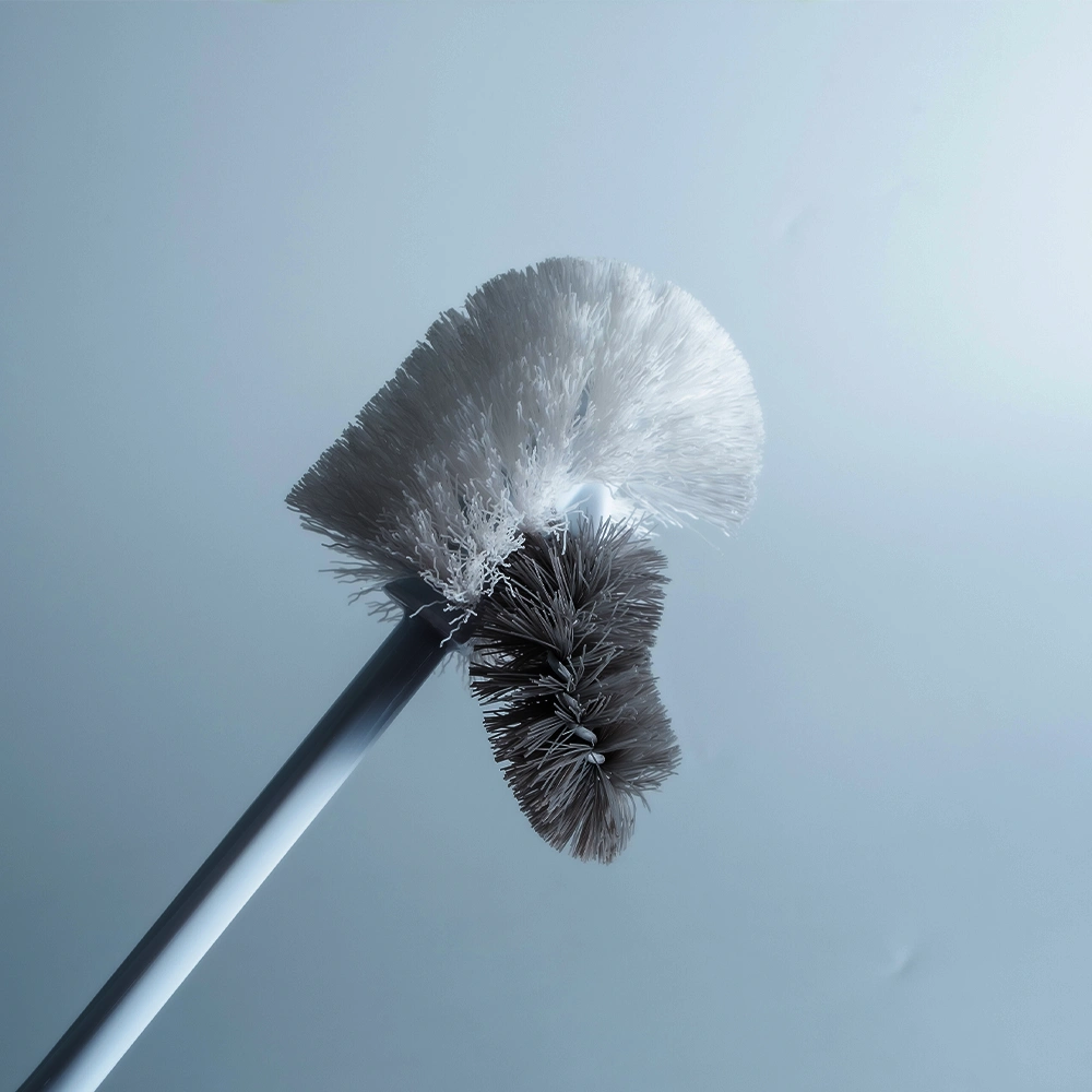A toilet brush with a small brush that can brush the edges of the toilet